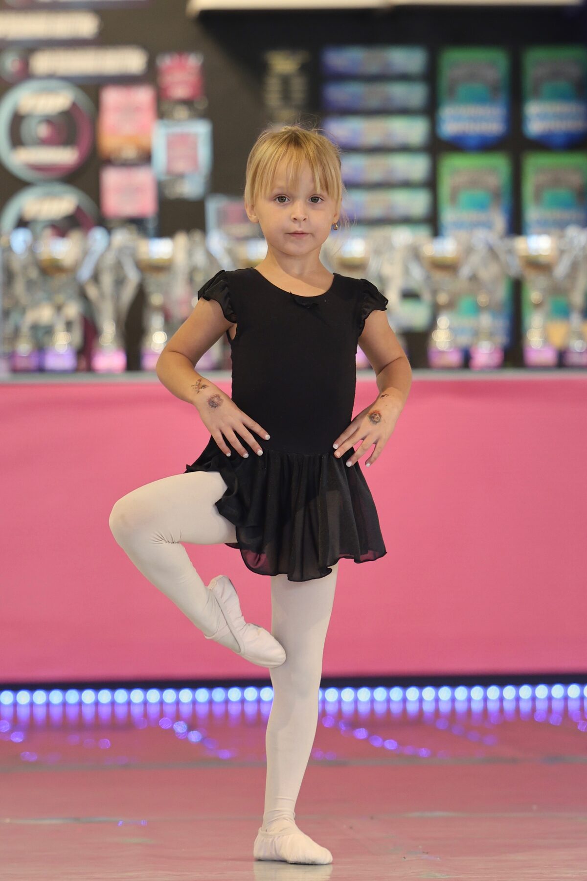Young ballet dancer posing on stage