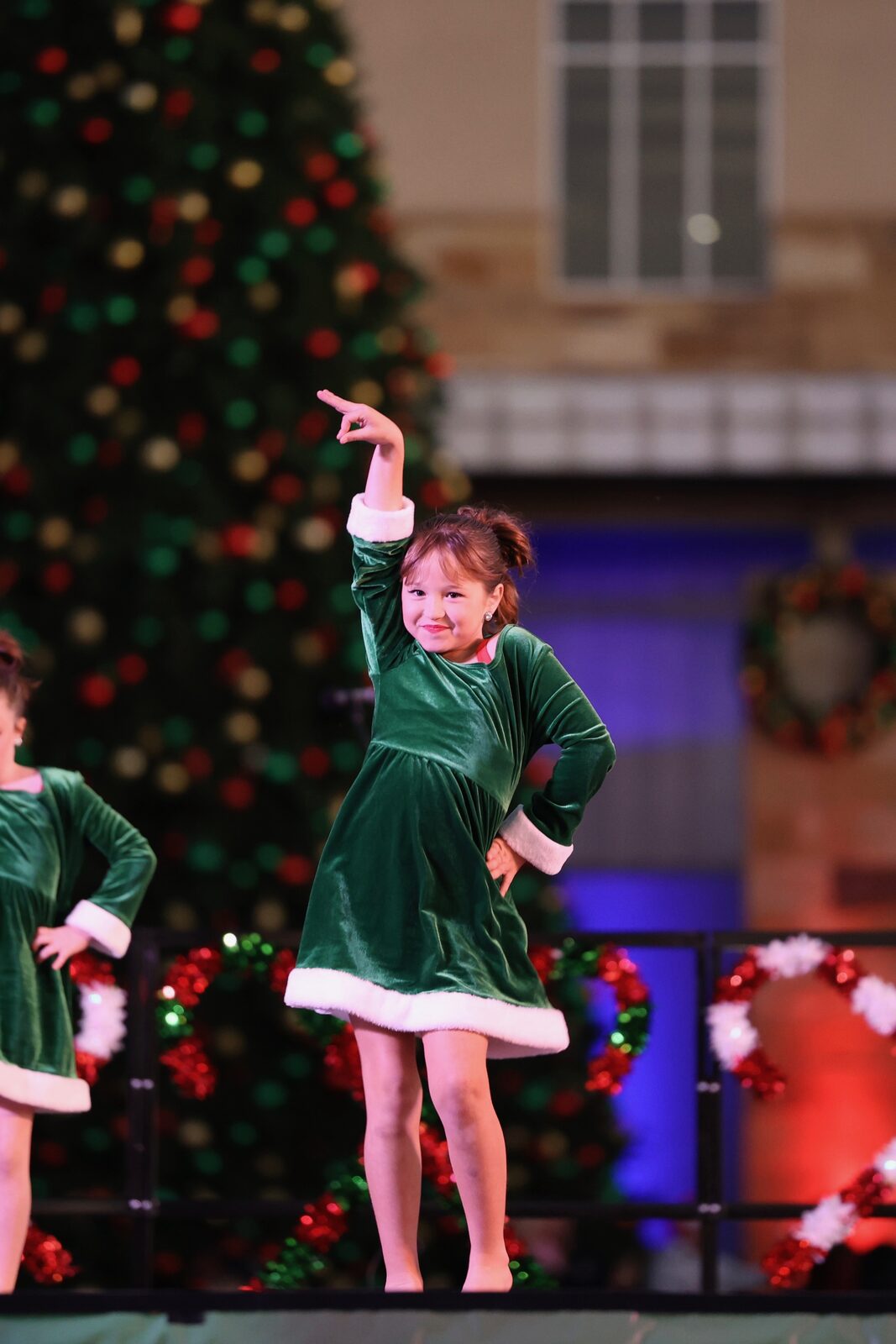 Project 520 dancer performing in a green velvet Christmas costume