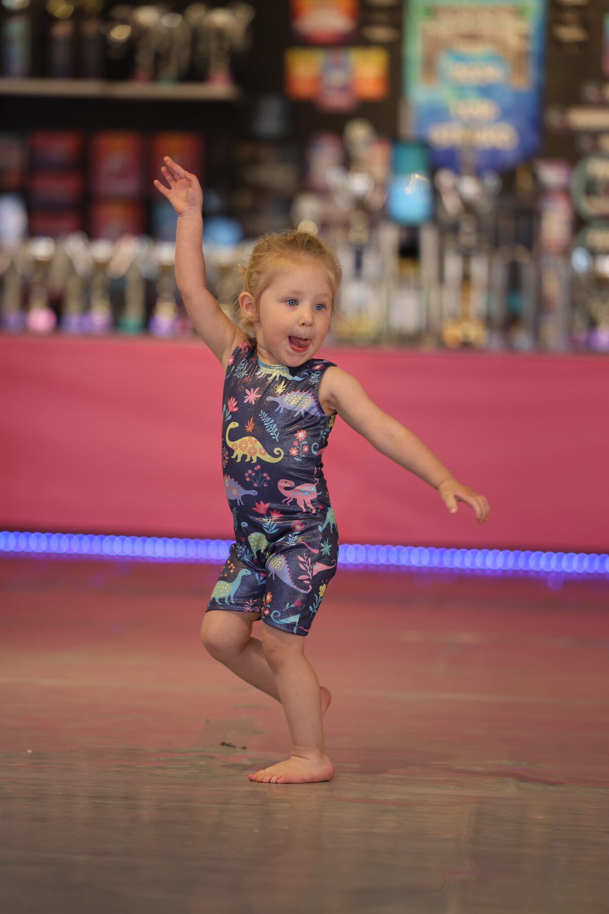 Preschool dancer smiling mid-move