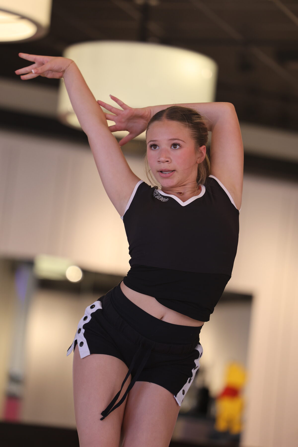 Competitive team dancer performing on stage
